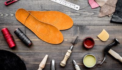 ruler, leather, shoepolish, thread, hammer, bradawl, wood, insole, tools, paint