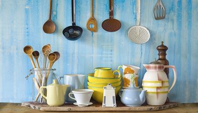 skimmer, sugarbowl, yellow, whisk, utensils, spoon, pitcher, spatula, teapot, wall, cups