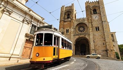 rail, pavingstone, yellow, markings, architecture, door, headlamp, tram, car, cathedral, arch