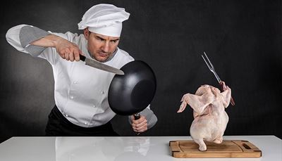 fryingpan, cuttingboard, countertop, chef'shat, grimace, gray, fork, chicken, fight, cuff, cook, knife