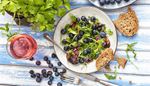 wineglass, blueberries, rosewine, plate, bread, parsley, arugula, salad, crumbs, fork, knife