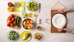 salad, tomatoes, tableware, bellpepper, cucumber, water, radicchio, zucchini, waiting, napkin, spoon