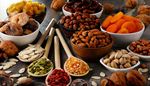 pumpkinseeds, driedfruit, driedapricot, gojiberries, pistachios, hazelnuts, raisins, walnuts, chestnut, nuts, driedfigs, corn, almonds, snack, spoon