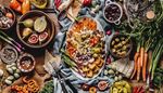cutlery, bellpepper, platter, carrot, scallions, spices, olives, figs, lemon